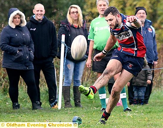 WATCHING OVER YOU: Jamie Mayall kicks for goal. 