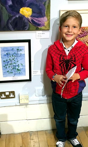 A BRUSH with fame . . . young Jacob Robinson with his painting at the Oldham Open