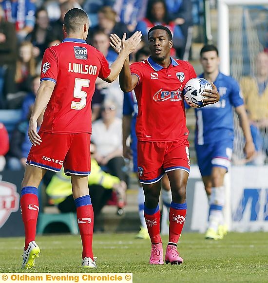 Dominic Poleon celebrates with James Wilson