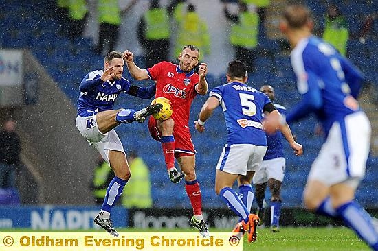 GETTING STUCK IN: Athletic skipper Liam Kelly (centre)