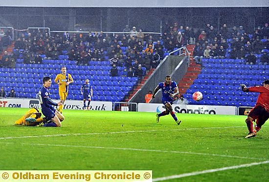 Danny Philliskirk scoring Latics opening goal.