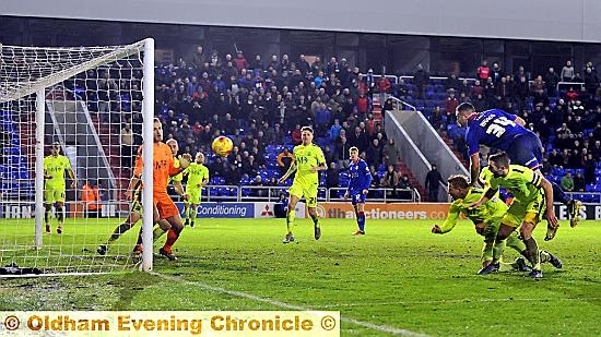 Michael Higdon scoring rising tallest for Latics second goal.