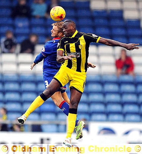 Joseph Mills makes an aerial challenge