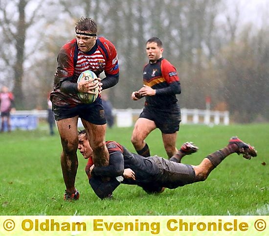 Nick Hackman resists a last-ditch Ashton tackle. 