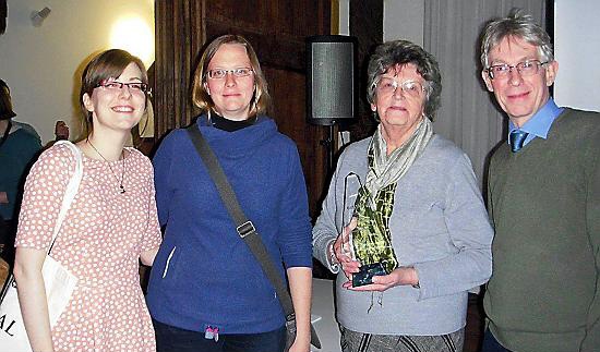 Laura Earnshaw (l) with (l-r) Joanne Robson, Archives Officer at Oldham Local Studies and Archives; Dorothy Bintley, a volunteer at the archive (holding the Archives and Records Association Volunteer Award for 2015); and Roger Ivens, Local Studies Officer