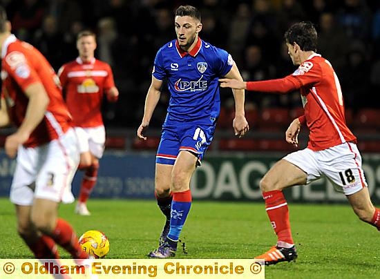 LOOKING TO KICK ON . . . Jake Cassidy tries to create an opening on his return to the side.