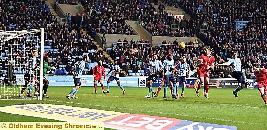 LATE, LATE SHOW . . . Danny Philliskirk (right) pops up to head a stoppage-time equaliser at the near post. Pictures by ALAN HOWARTH
