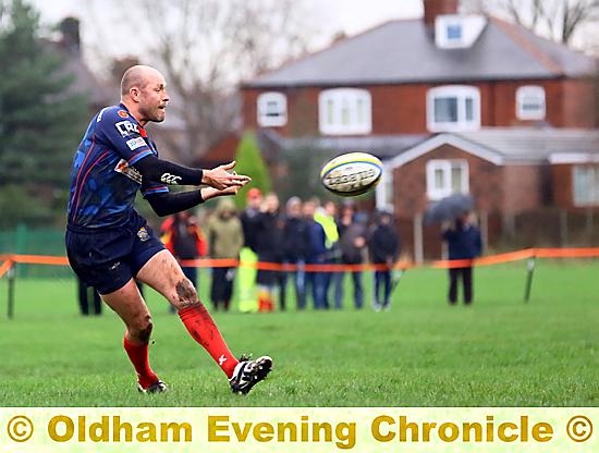 ON THE FRONT FOOT: Gareth Barber throws a pass for Oldham. Picture: TIM ABRAM.
