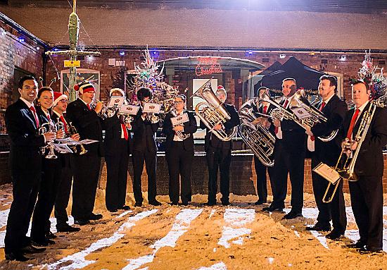 NOTEWORTHY performance . . . Lees Band (Oldham) blast out the best of brass on the cobbles