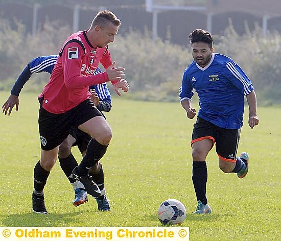 DOUBLE SALVO . . . Oldham GPO’S Mike King (left) scored both goals in a victory against Carrion Crow.