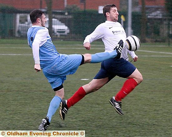 FOOT UP: Heyside’s Daniel Dunne (left) tries to halt an opponent.
