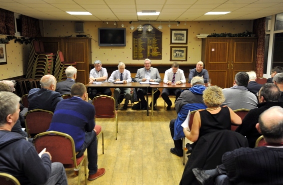 MEMBERS gather round at the first meeting of the new committee