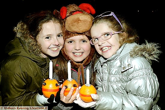 THREE candles: (l-r) Tilly Butterworth (10), Megan Shepherd (8) and Hetty Butterworth (9) enjoy Diggle’s Christmas switch-on