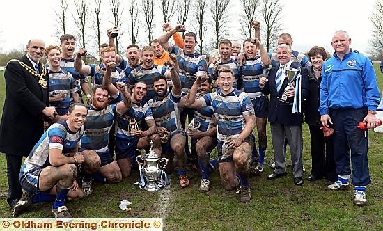 CUP KINGS . . . Oldham Mayor, councillor Fida Hussain, joins in the celebrations with the Rochdale Mayfield team.