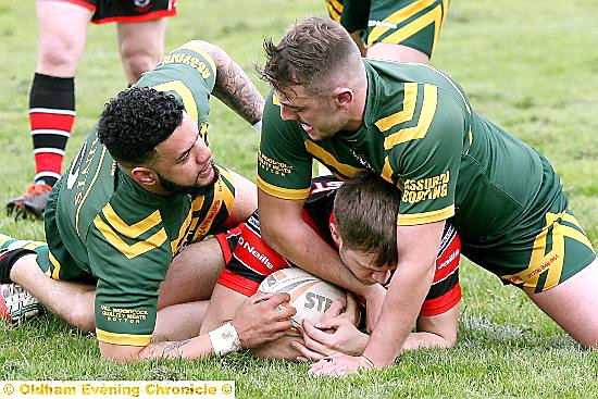 St Anne’s, pounce on a Leigh East player in the National Conference League Division Two clash at Higginshaw Road. PICTURE: PAUL STERRITT
