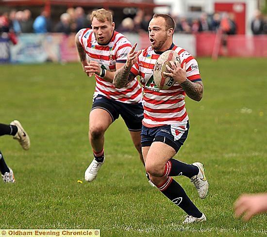 ON THE BURST: Steve Roper flies down the field for Oldham.