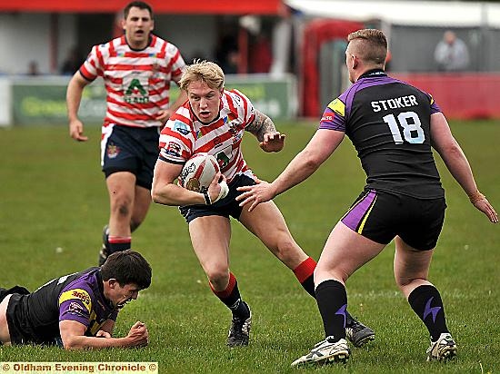 INSIDE LINE: Oldham centre George Tyson prepares to push off in his side’s comfortable win.