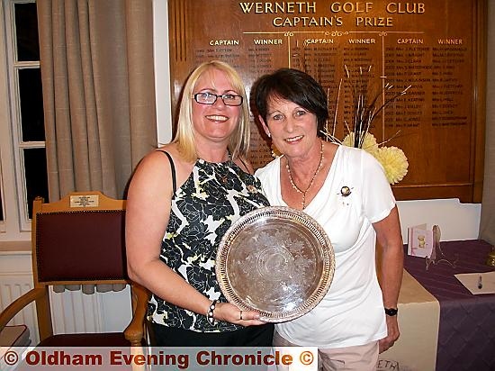 ALL YOURS: Tracey Rowbotham (left) receives the Marie Hufton Salver from lady captain Kay Broughton.