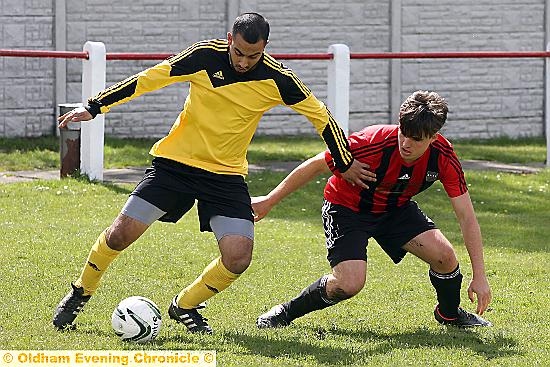 CLOSE CALL . . . Coppice United’s Shabir Ali (left) holds off Athletic’s Tom Woods.