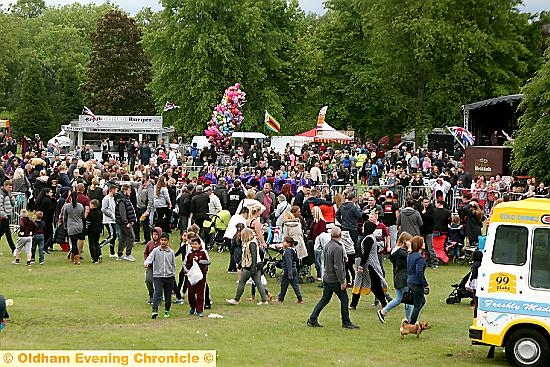 BUSY, BUSY! . . . large crowds enjoy the fun at Alexandra Park.