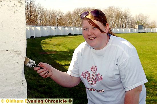 LICK of paint . . . Olivia Whittaker and other youngsters on the Prince’s Trust project spent time improving the ground at Oldham Cricket Club