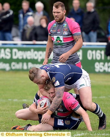 STOP THERE: Oldham’s Gareth Owen is halted.
