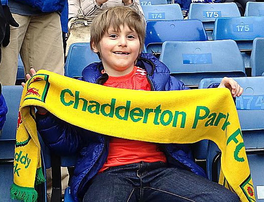 Jude with his Chadderton Park FC scarf watches Chelsea play at Stamford Bridge