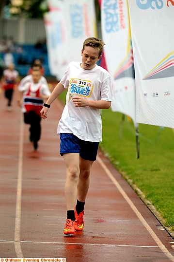 CROSSING the line . . . New Bridge School’s Lewis Heywood wins the 400m race in the disability category