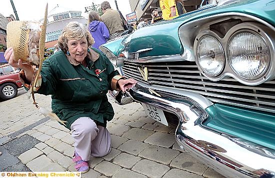 Vintage car show Oldham High Street.

Ruth Rhodes hats off to 1958 Plymouth Savoy