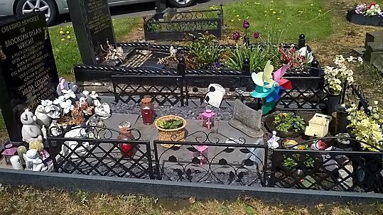 THEFT AND DAMAGE ... Brooklyn Dylan Wright's grave before thieves stole ornaments and lights