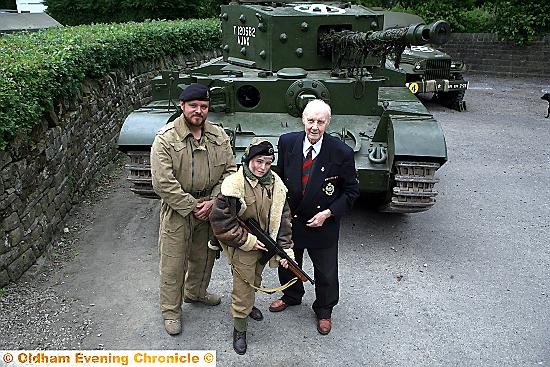 STAR of the show . . . the Cromwell tank with Normandy veteran John Whyman (right), tank owner Rick Wedlock (left) and Cameron Stevens (13), dressed in tank commander’s uniform from the Second World War
