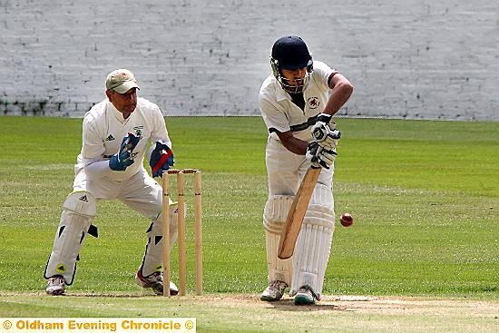 TAKING NO CHANCES . . . Janaid Maqsood of Whalley Range goes on the defence against Moorside.