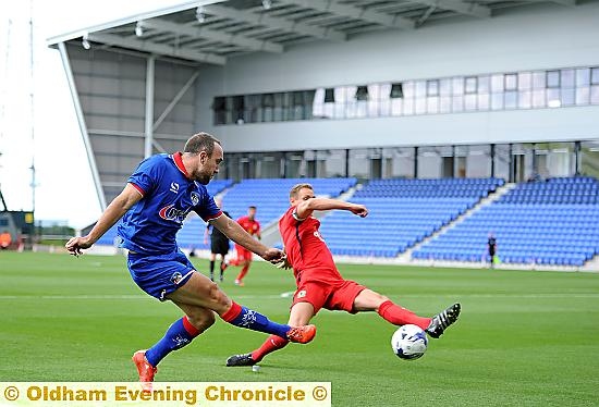 ON THE ATTACK . . . Lee Croft gets in a cross against Blackburn. 