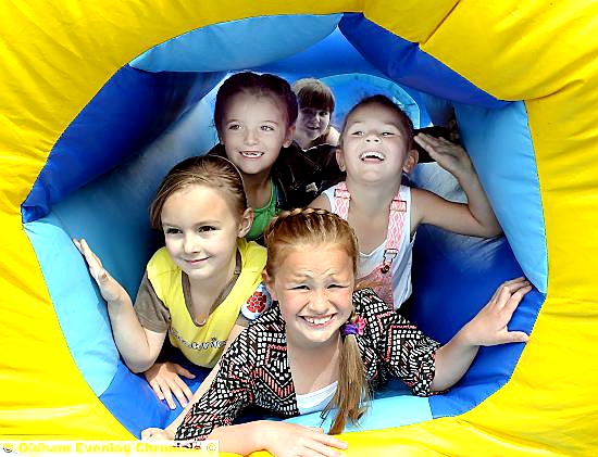 bouncy castle fun: (from left) Imogen Cowan, Analeise Chadderton, Freya Brennan and Talia Brennan. Pictures by Tim Bradley