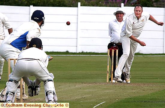 PROBING SPELL: Andy Yates, who took three for 24 in Crompton’s victory over Elton, sends a delivery to visitors’ top scorer Paul Challinor. 