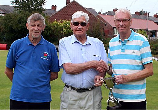 John Atkinson (left) and Price are pictured either side of league president Bill Connolly at the presentation.