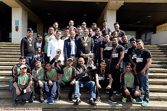 Oldham Dragons and Oldham Tigers met the Mayor (centre) to show off their trophies. Holding the cups are team managers Miftha Miah (centre left) for the Tigers and Nanu Miah (centre right).