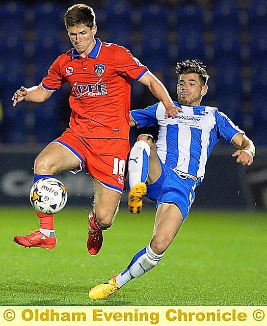 CLOSE CONTROL . . . from Athletic’s Danny Philliskirk during an attempt to get his team moving forward.