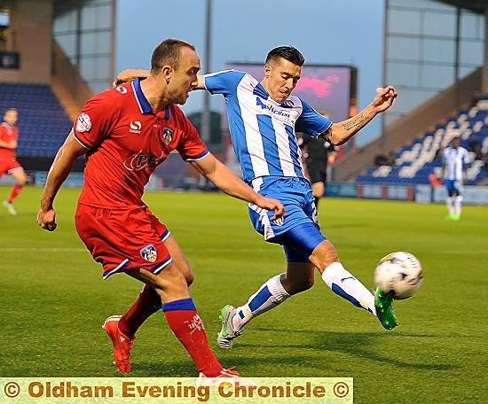 HARD GRAFT . . . Lee Croft crosses during one of several raids down the right flank.