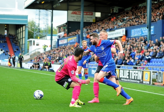 ON THE ATTACK: Mark Yeates tries to squeeze through a gap.