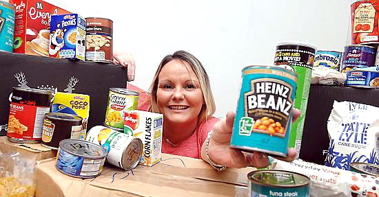 BOWL of human kindness . . . Tracy Hepburn with the food donations