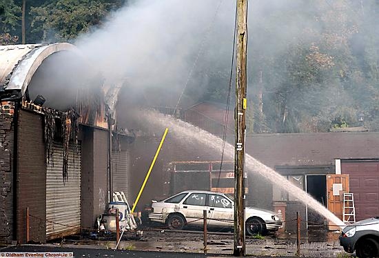 FIREFIGHTERS tackle the workshop blaze