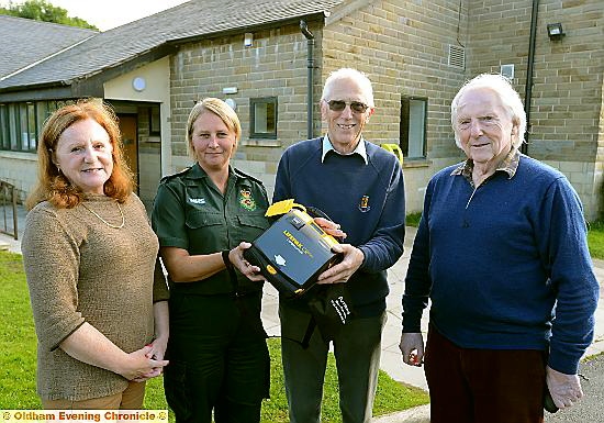 paramedic Lisa Stanley of North West Ambulance Service with guardians Valerie and Martin Smith and former councillor Alan Roughley.