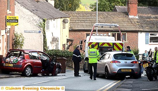 A woman was trapped after a Seat Leon and a Renault Megane collided on Roundthorn Road.