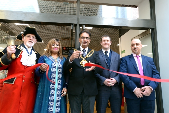 Mayor Councillor Ateeque Ur-Rehman cuts the ribbon to open the new TJ Hughes store, with (from left) Clitheroe town crier Roland Hailwood, Mayoress Councillor Yasmin Toor, Jason Harmer, head of
