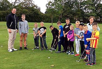 SOUND ADVICE . . . professional Andy Earlam passes on tips to the youngsters at Oldham.