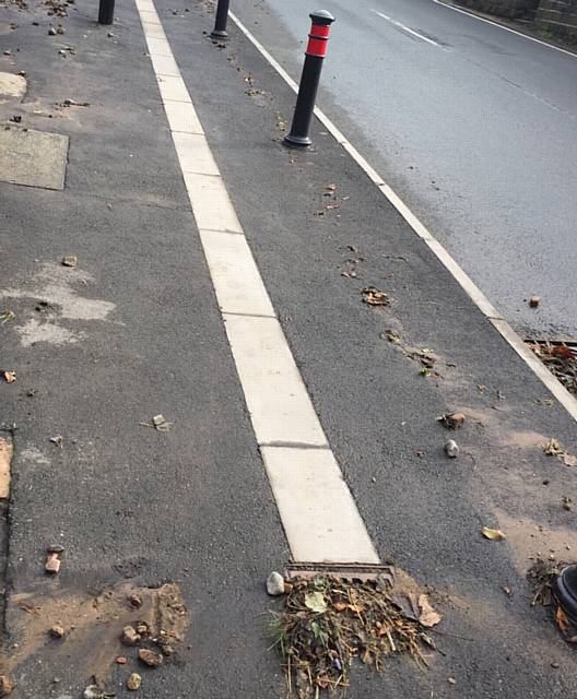 MUCKY path . . . the pavement on Huddersfield Road 