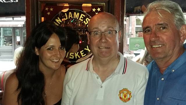 Kat Crean (left) with her dad Mike Crean (centre) at Dublin's Temple Bar in June for his 60th birthday