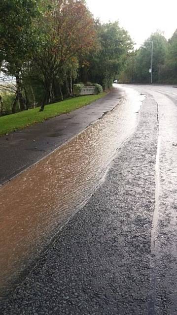 Damage caused by burst water main on Manchester Road, Greenfield at the junction with Dacres Road.