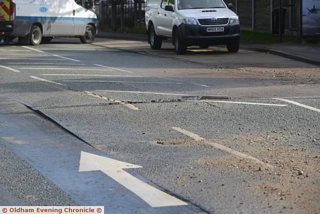 Damage caused by burst water main on Manchester Road, Greenfield at the junction with Dacres Road.